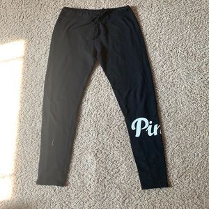 Leggings, small, black with pink label on leg